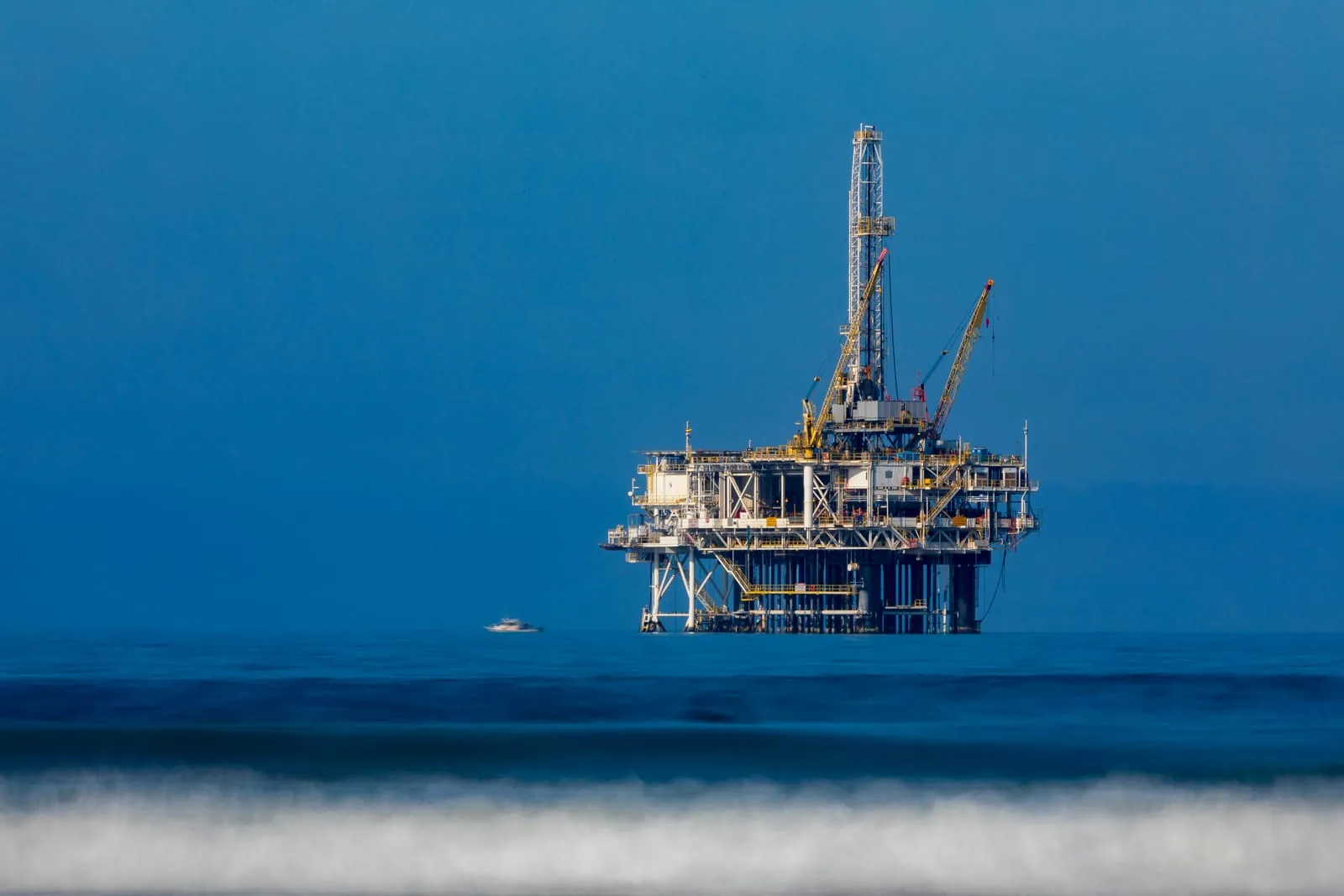 Offshore oil and gas platform in blue water