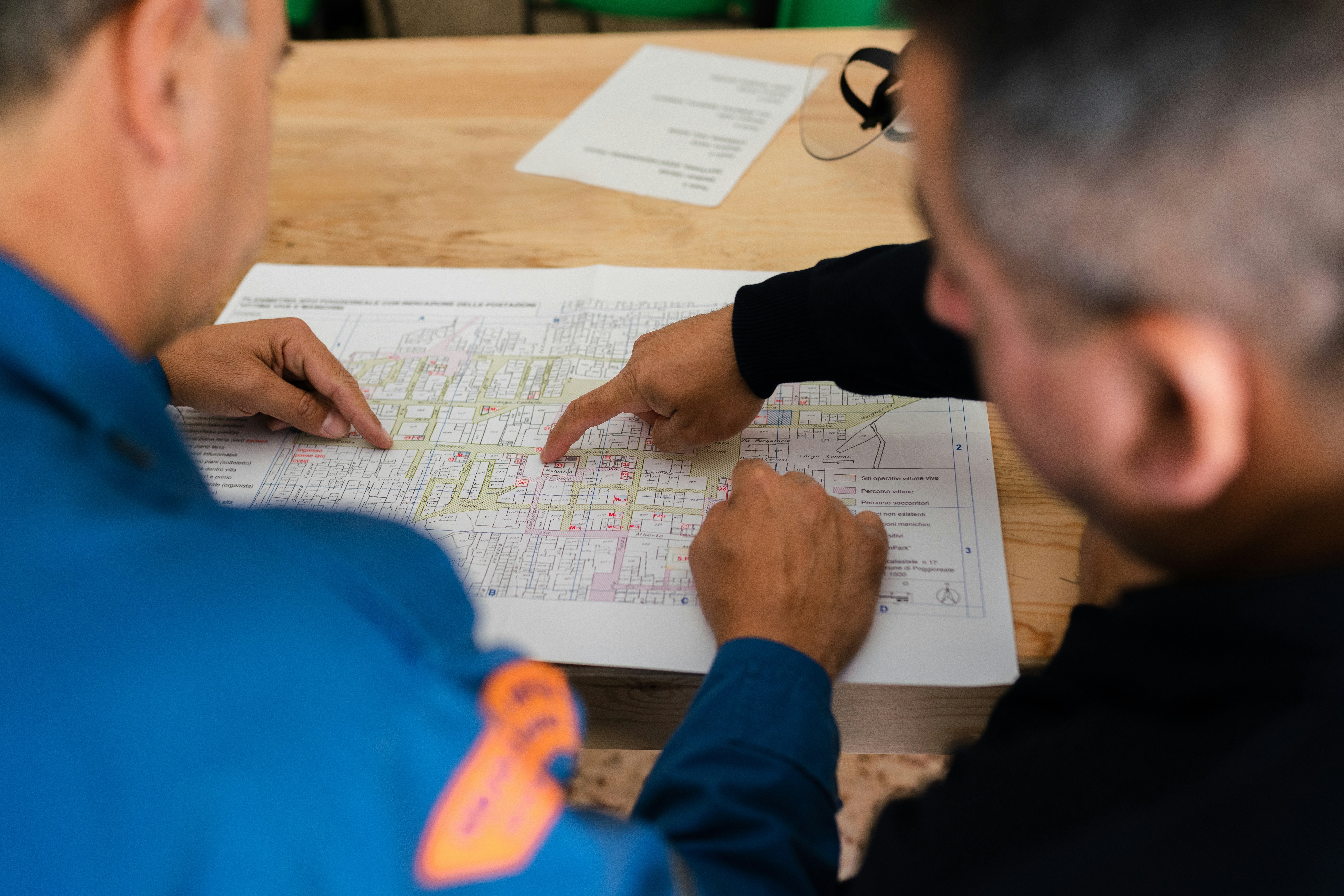 Engineers reviewing technical plans on a table