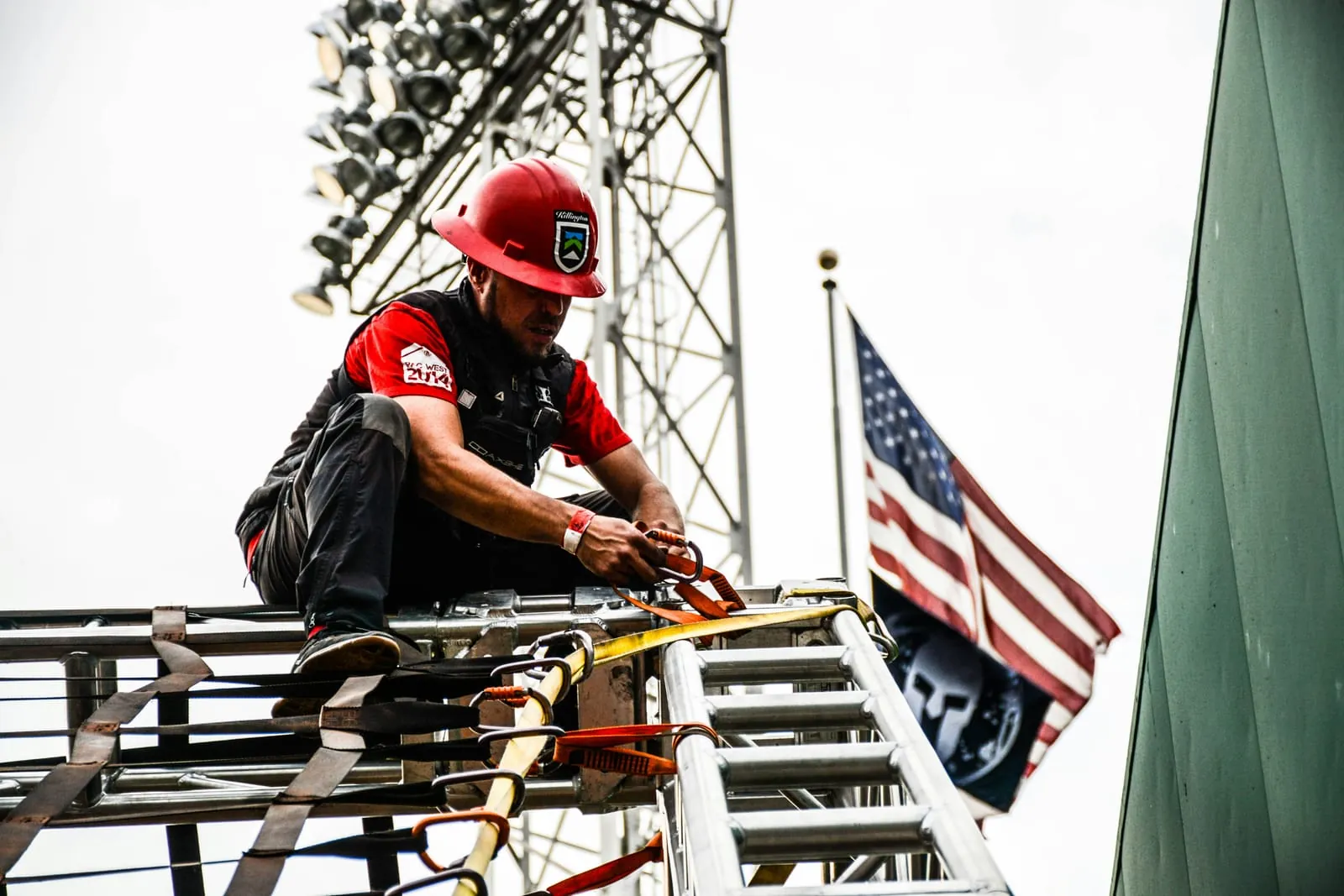 Technician working on a telecom tower